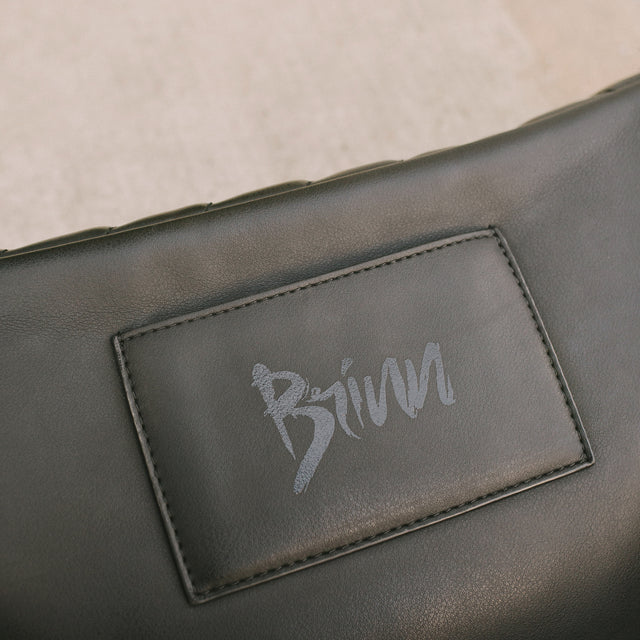 Detailed shot of the back of the Honeypie Bum Bag with the edgy Brinn logo and card pouch